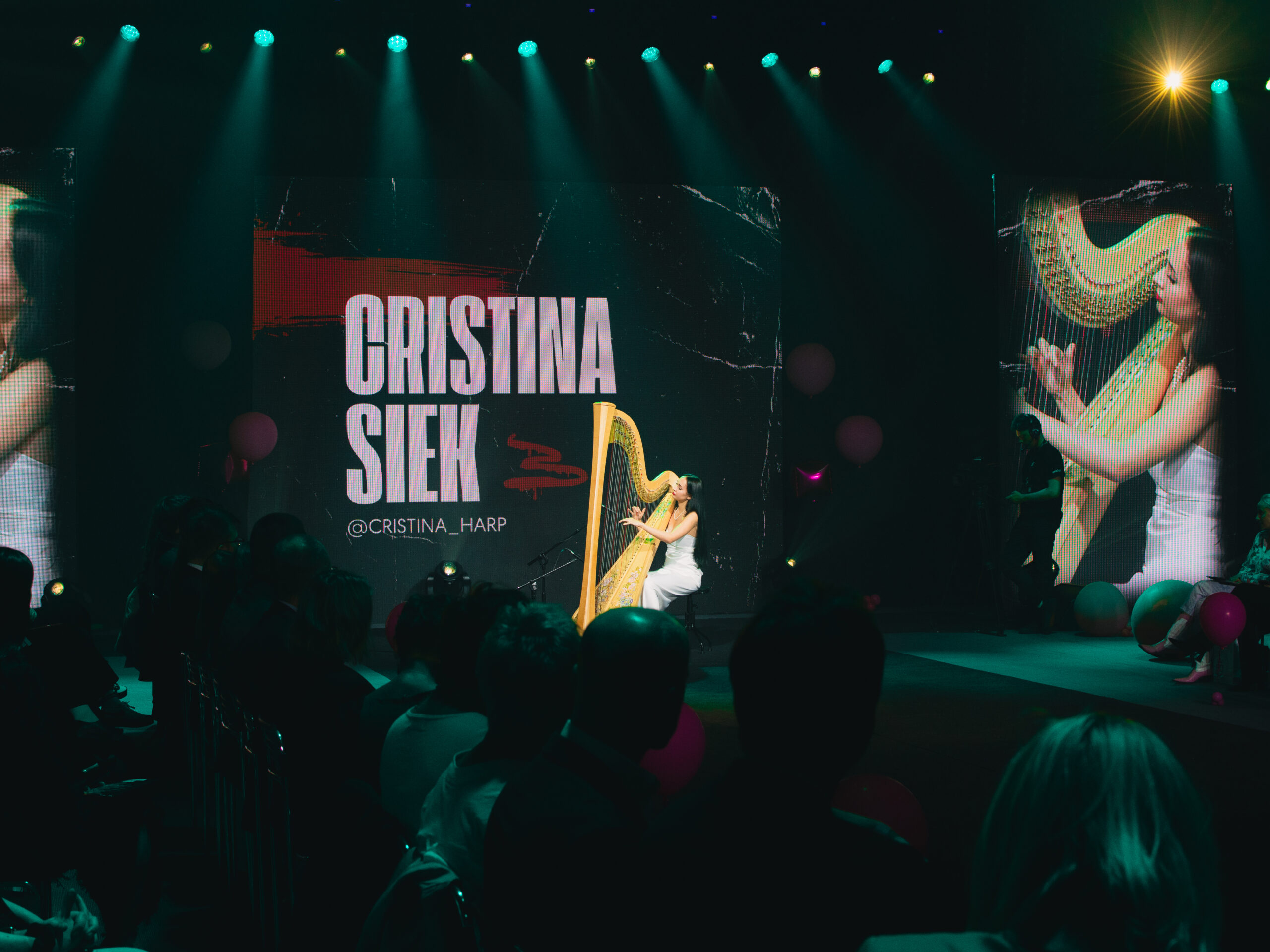 Harpist Krystyna Siek performing live at a fashion show