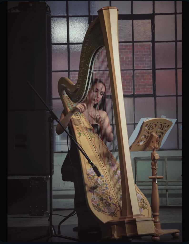 Harpist Krystyna Siek performing live at a fashion show